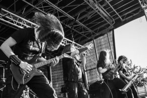 Black Metal band Inverted Saint live with guitar players singer and bass player